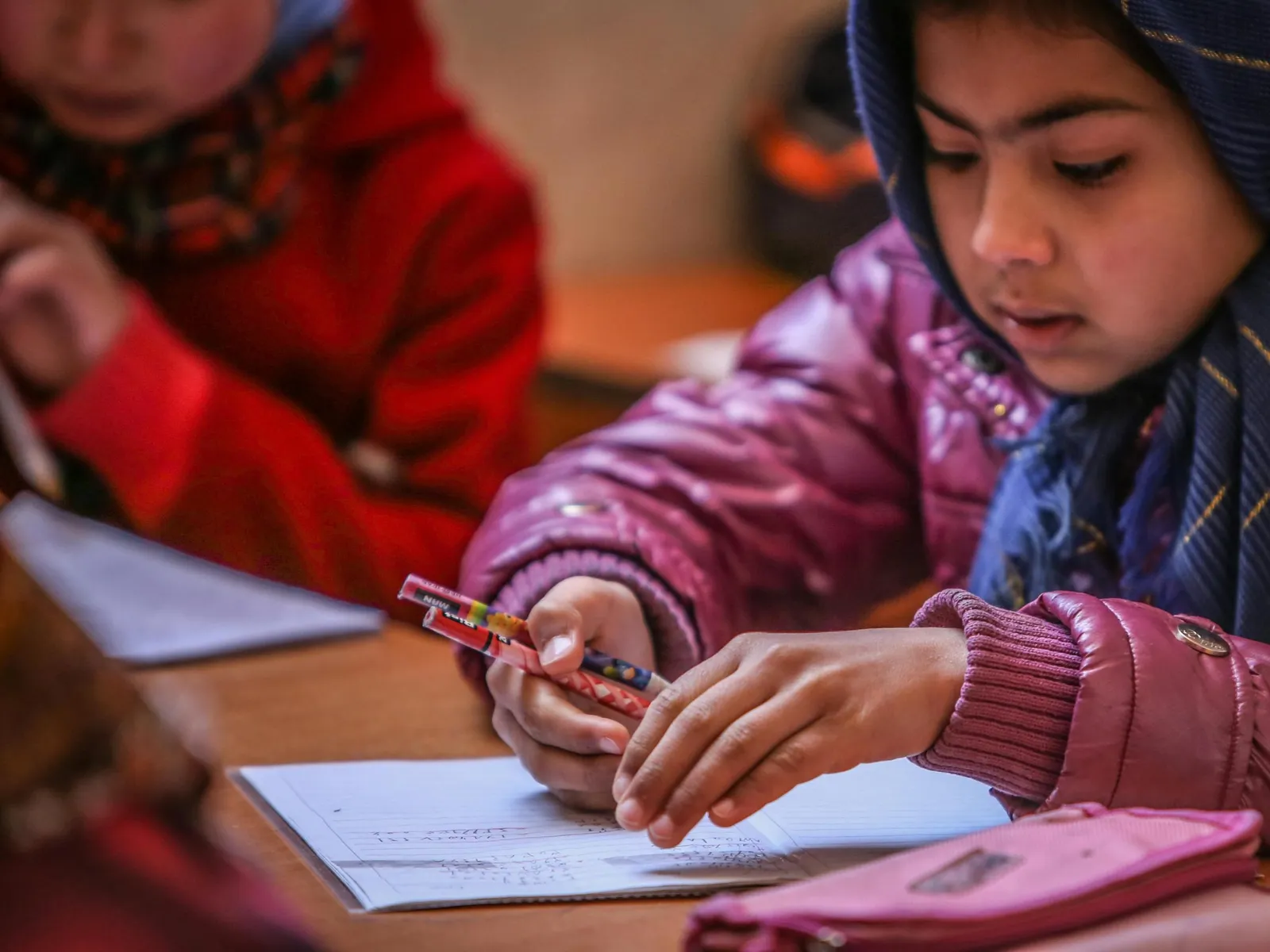 Young Afghan Student writing